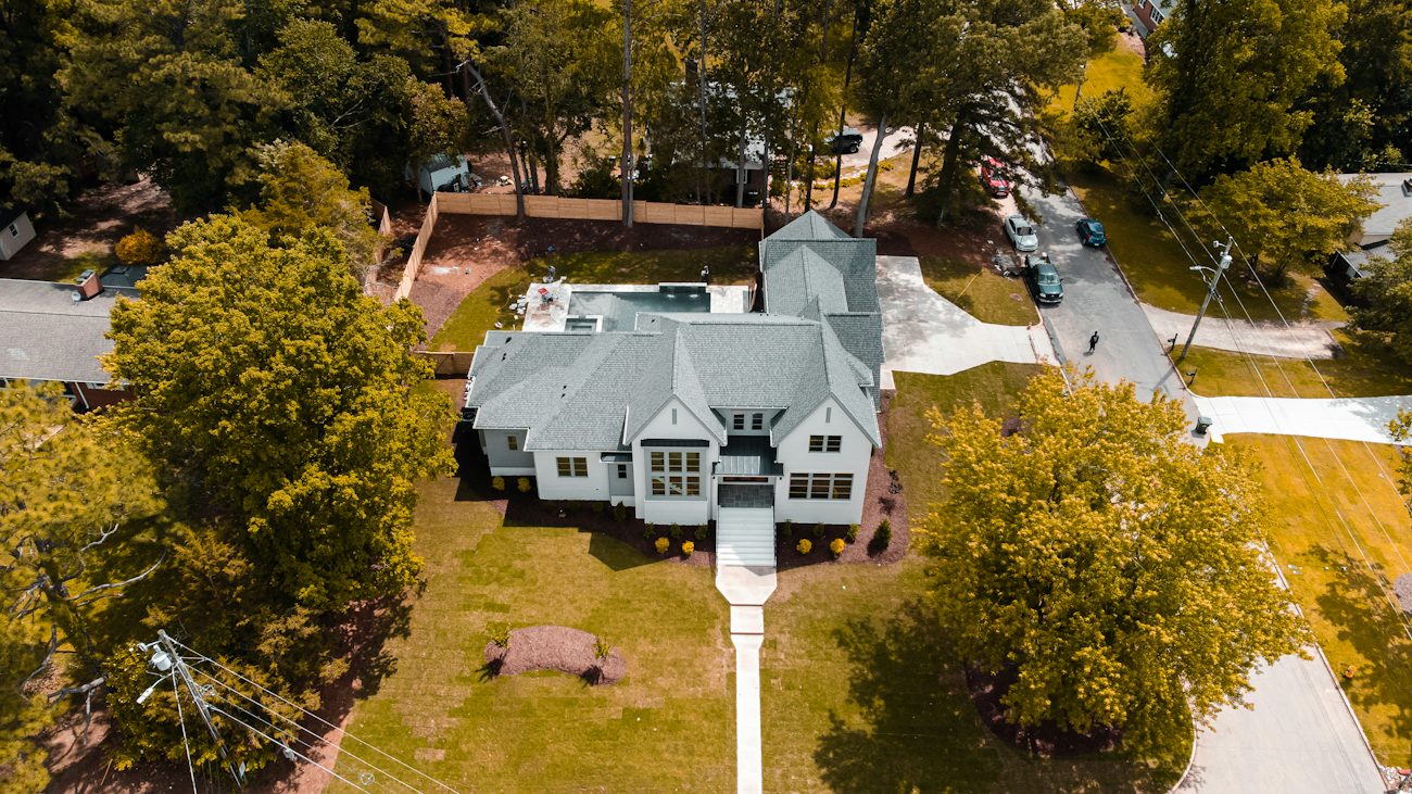 Aerial view of a home and its neighborhood